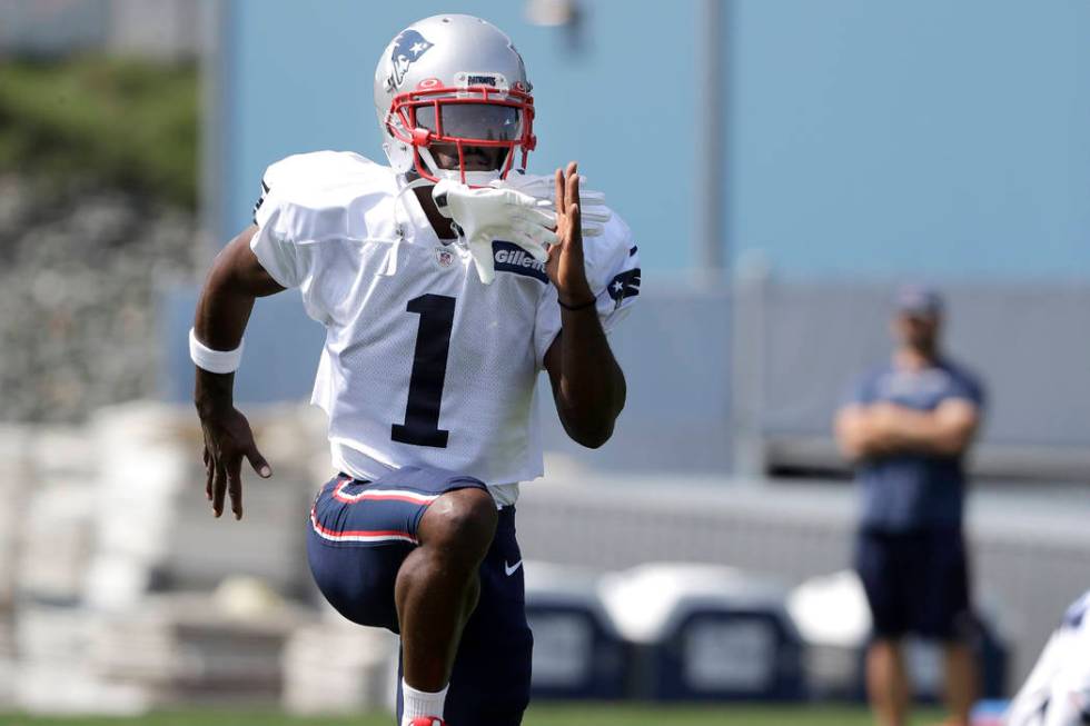 New England Patriots wide receiver Antonio Brown works out during NFL football practice, Wednes ...