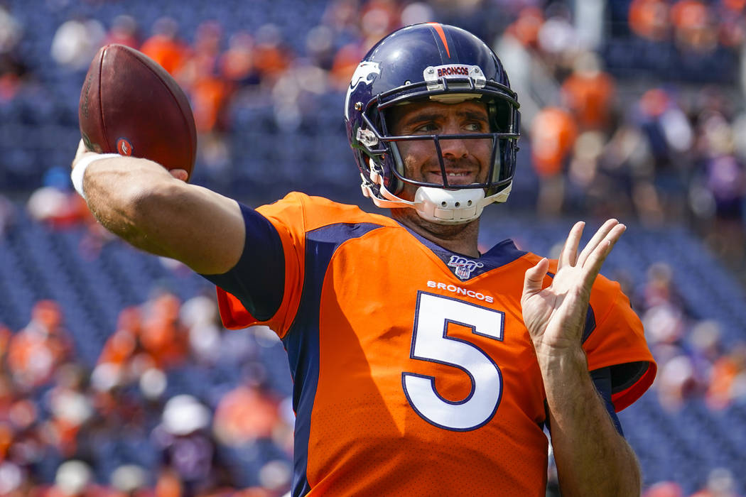 Denver Broncos quarterback Joe Flacco throws before an NFL football game between the Denver Bro ...