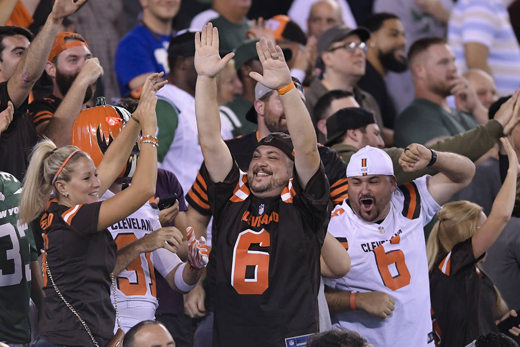 Cleveland Browns fans cheer during the second half of an NFL football game against the New York ...