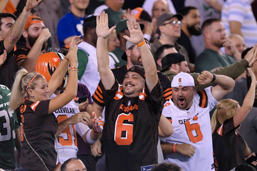 Cleveland Browns fans cheer during the second half of an NFL football game against the New York ...