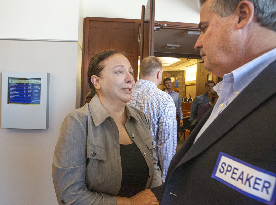 Retired Metro sergeant Steven Meriwether talks to Kelly Brewer after her son Alexander Brewer w ...