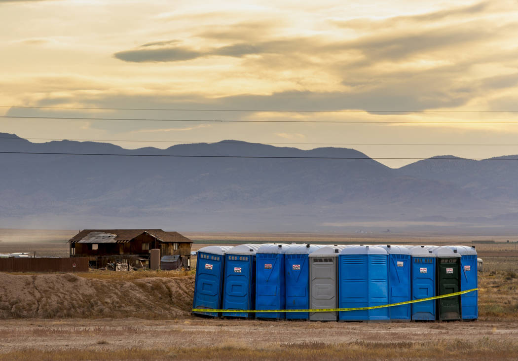 A set of port-a-potties has been set on the edge of the Alienstock festival grounds where the f ...