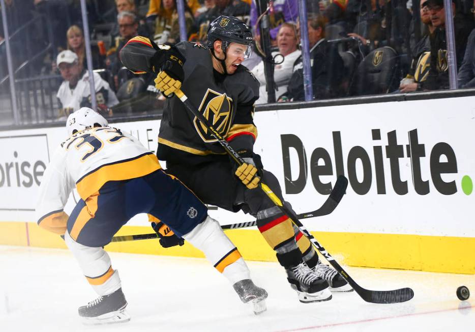 Golden Knights defenseman Brayden McNabb (3) moves the puck past Nashville Predators right wing ...