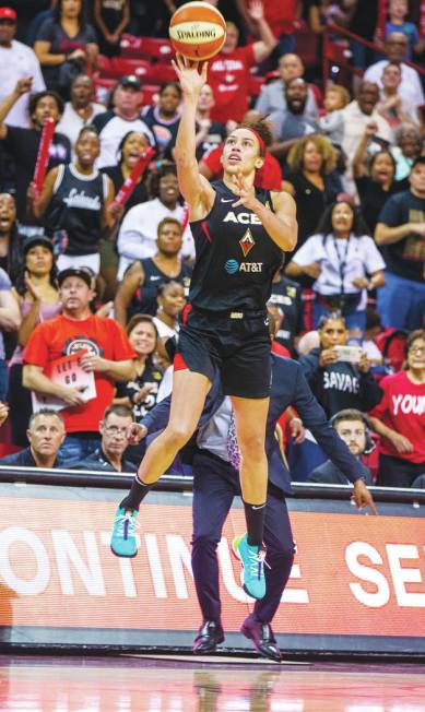 Las Vegas Aces forward Dearica Hamby (5) makes a late-game three-point-shot over the Chicago Sk ...