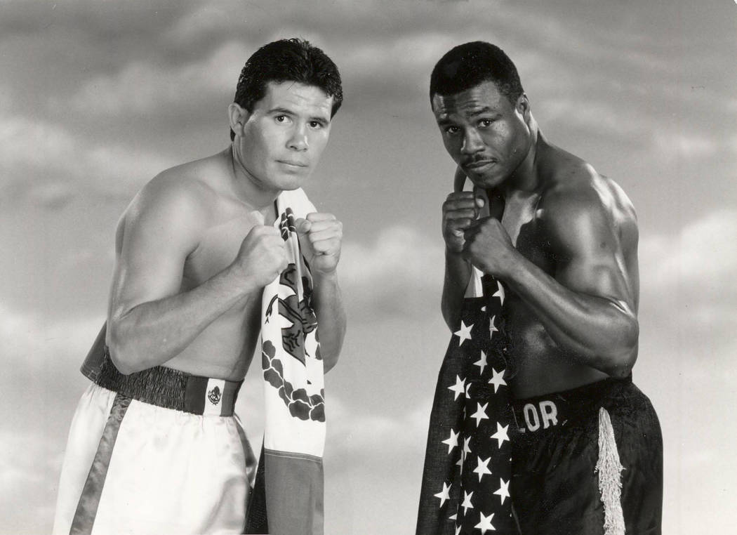 Boxer Julio Cesar Chavez, left, poses with his opponent Meldrick Taylor in this 1990 promotiona ...