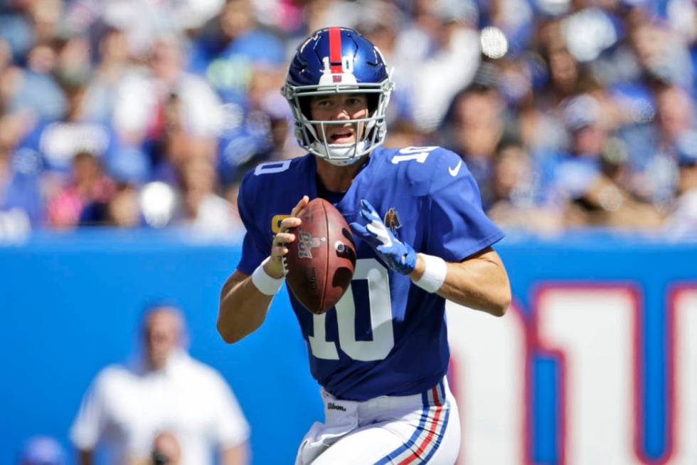 New York Giants quarterback Eli Manning looks to throw during the first half of an NFL football ...