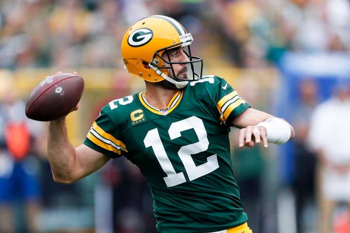 Green Bay Packers' Aaron Rodgers throws during the first half of an NFL football game against t ...