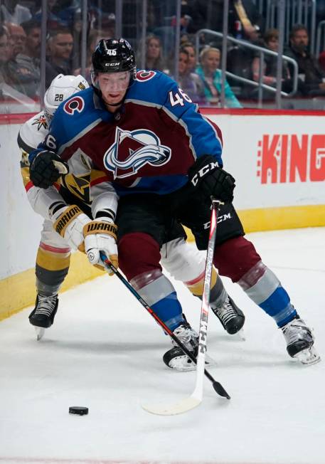 Colorado Avalanche defenseman Nicolas Meloche (46) edges out Vegas Golden Knights left wing Wil ...