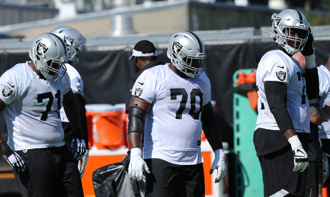 Oakland Raiders offensive linemen, from left, tackle Justin Murray (71), guard Jonathan Cooper ...