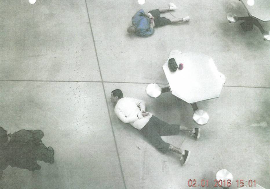 Anthony Williams and Tarik Goicoechea are handcuffed on the floor of High Desert State Prison a ...