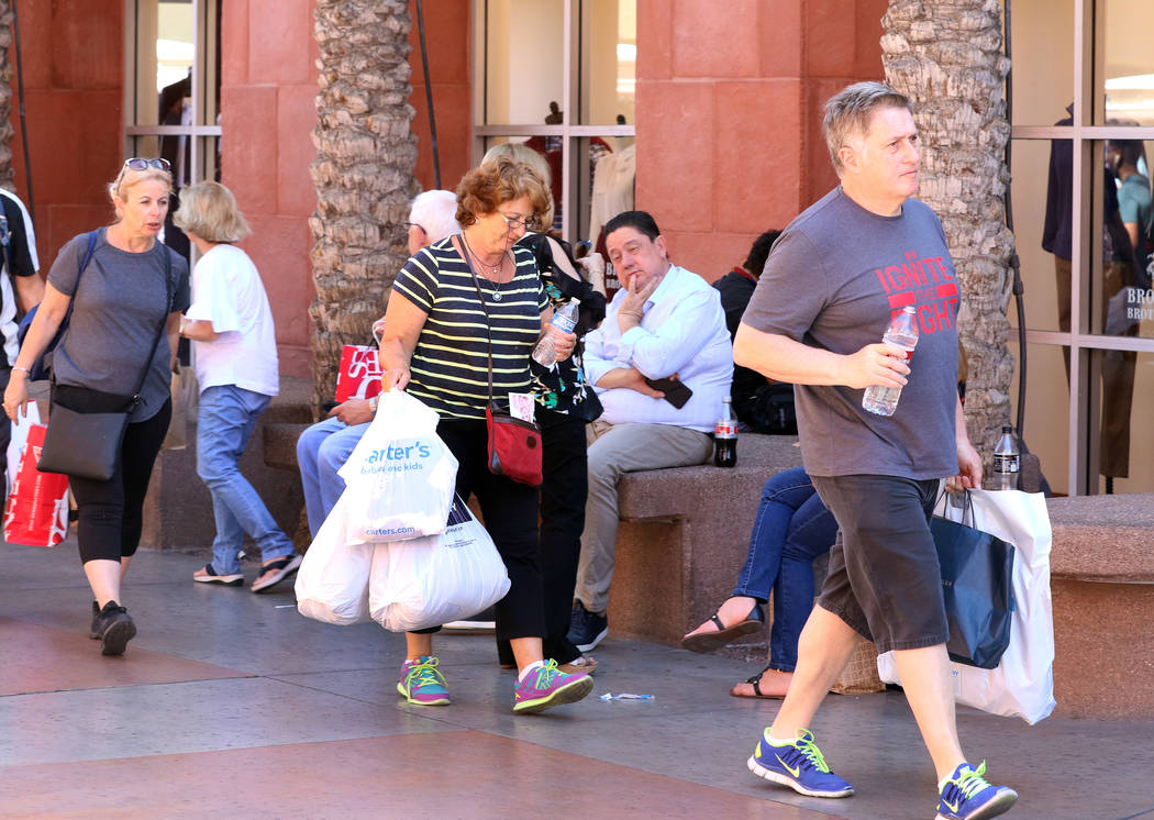 Shoppers walk through Las Vegas North Premium Outlets on Tuesday, Sept. 17, 2019. The outlet ma ...