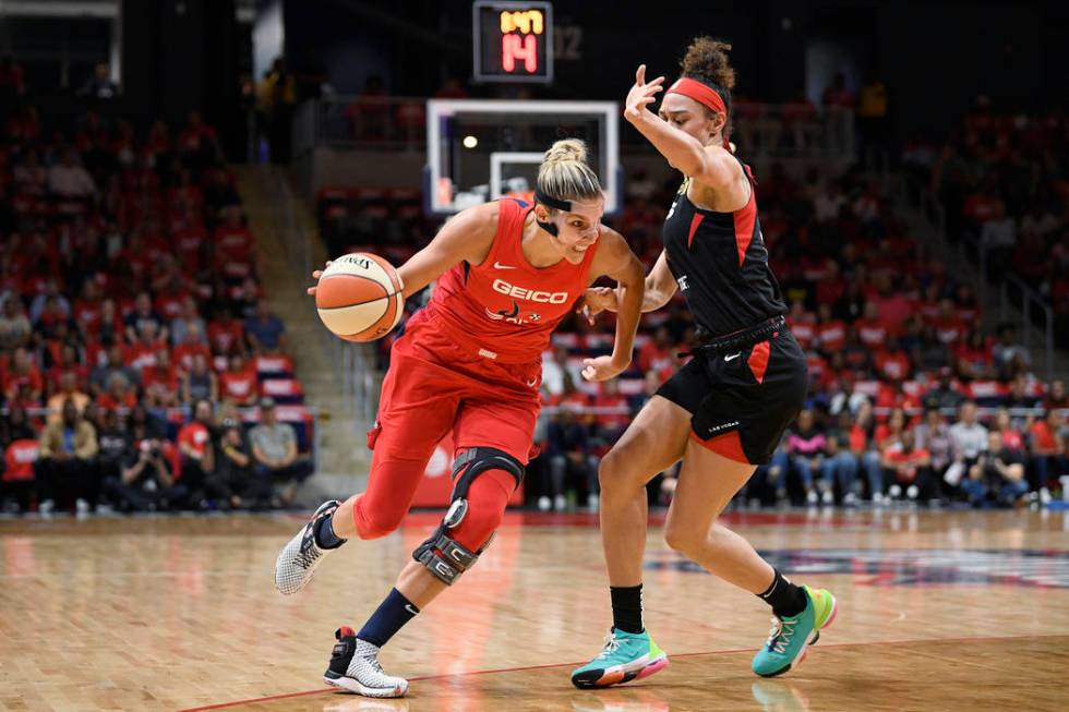 Washington Mystics forward Elena Delle Donne, left, drives to the basket against Las Vegas Aces ...