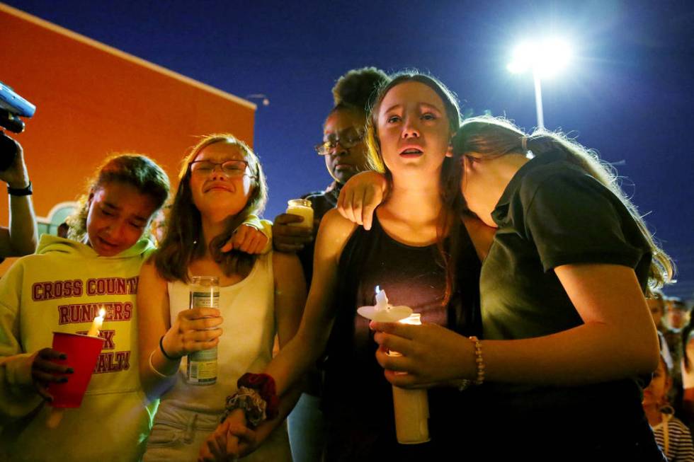 Monet Garcia's friends MacKenna Calvin, 12, from left, Diamond Espinosa, 12, Layla McKnight, 12 ...