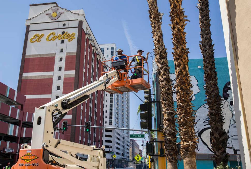 Big Vision entertainment workers Noah Wynia, left, and Shane Smith run fiber for camera and vid ...