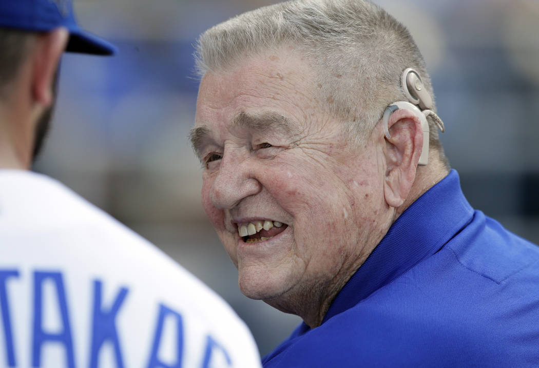 Former Kansas City Royals manager Whitey Herzog smiles while talking with Royals' Mike Moustaka ...