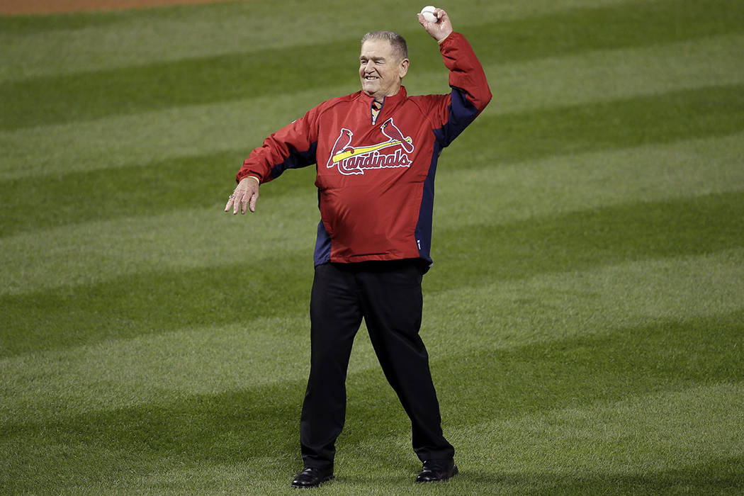 Formal St. Louis Cardinals manager Whitey Herzog throws out the ceremonial first pitch before G ...