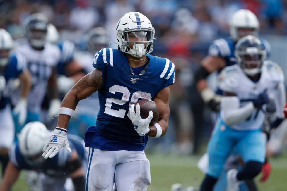 Indianapolis Colts running back Jordan Wilkins (20) runs the ball against the Tennessee Titans ...