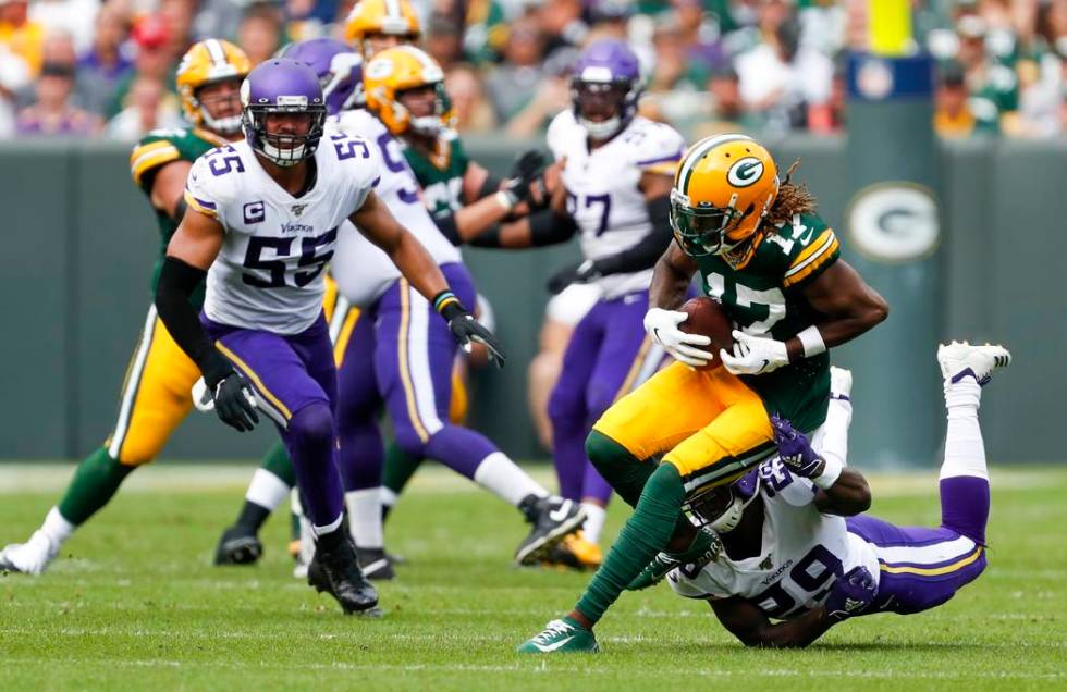 Green Bay Packers' Davante Adams runs after catching a pass during the second half of an NFL fo ...