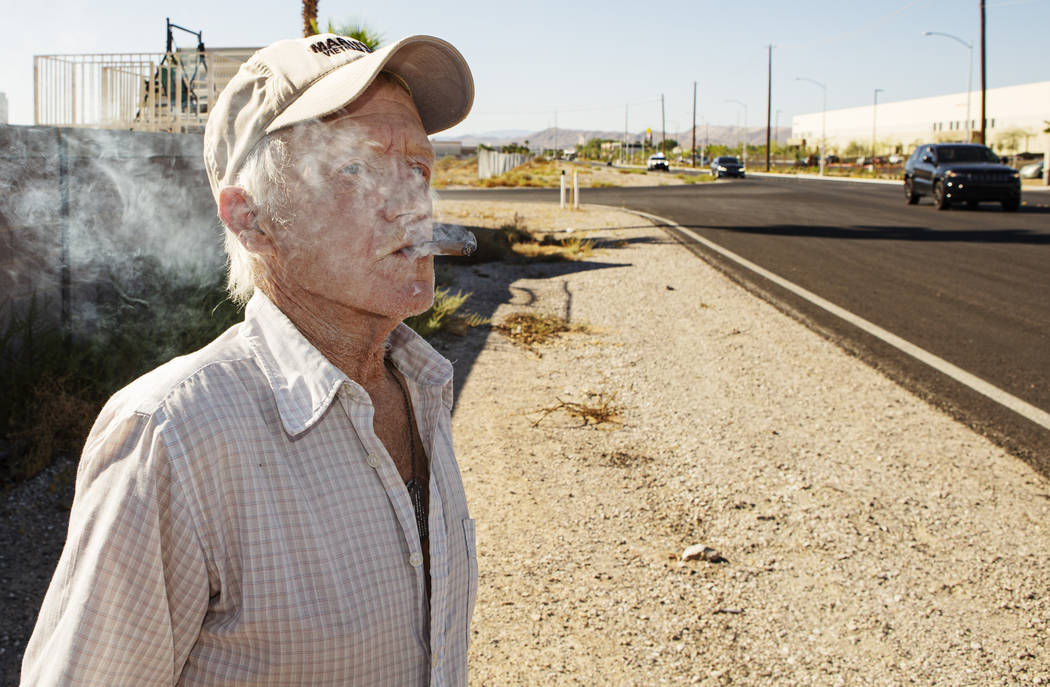 Jim Ludwick watches as trucks drive through his Enterprise neighborhood in southwest Las Vegas, ...