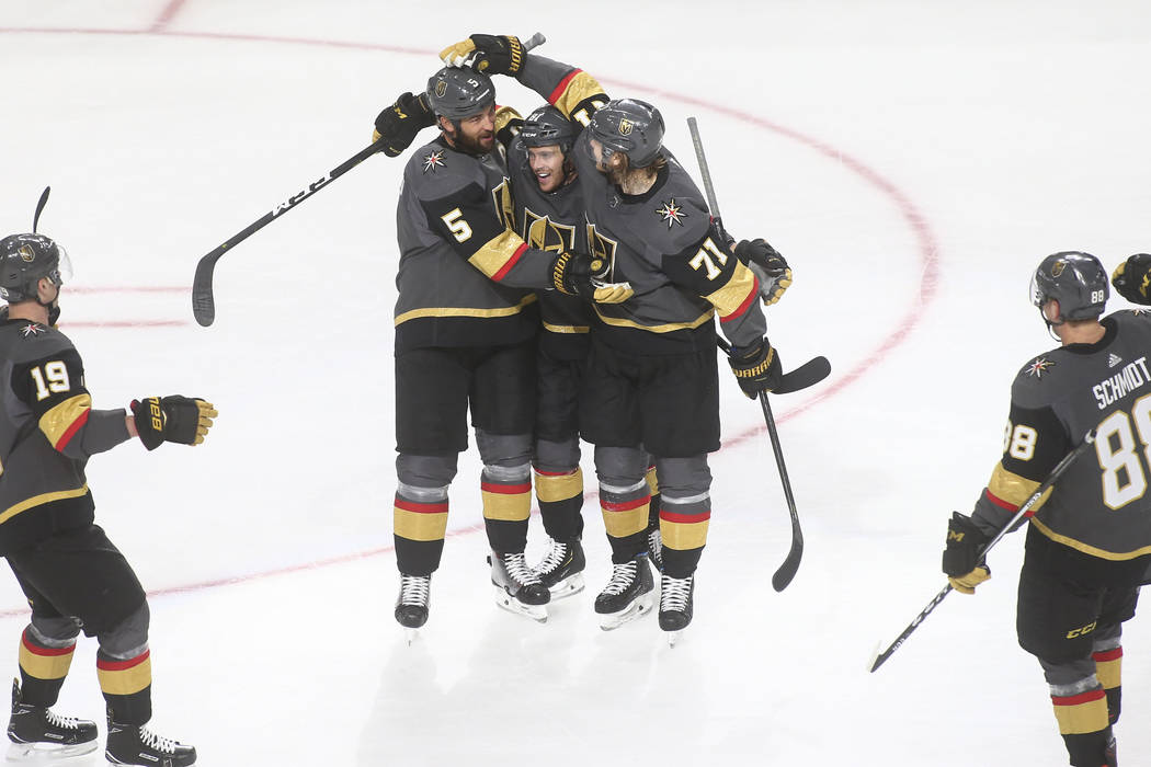 Golden Knights defenseman Deryk Engelland (5) celebrates his goal with Jonathan Marchessault, c ...