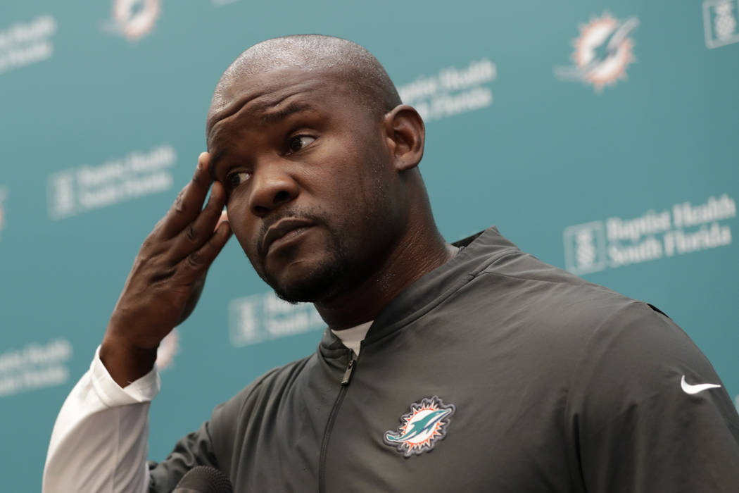 Miami Dolphins head coach Brian Flores speaks during NFL football training camp in Davie, Fla. ...