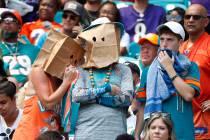 Miami Dolphins fans shows his displeasure with the team during the first half at an NFL footbal ...