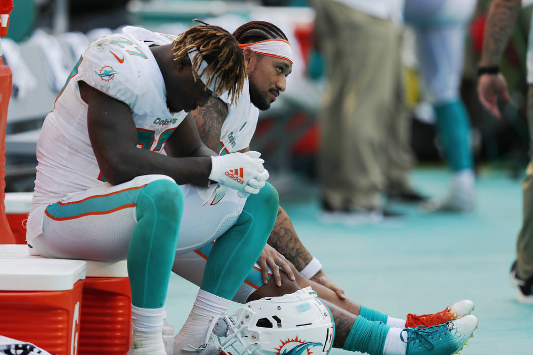 Miami Dolphins running back Kalen Ballage (27) sits on the sideline during the second half at a ...