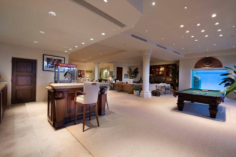 The game room has a bar, pool and poker tables. (Synergy Sotheby’s International Realty)