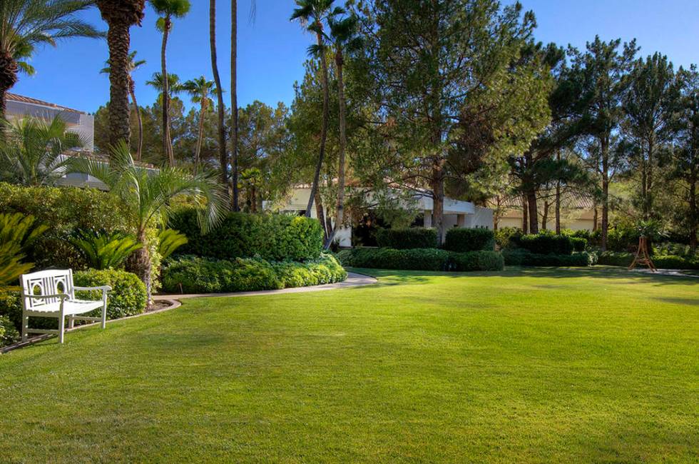 There is a grassy area in front of the guest home. (Synergy Sotheby’s International Realty)