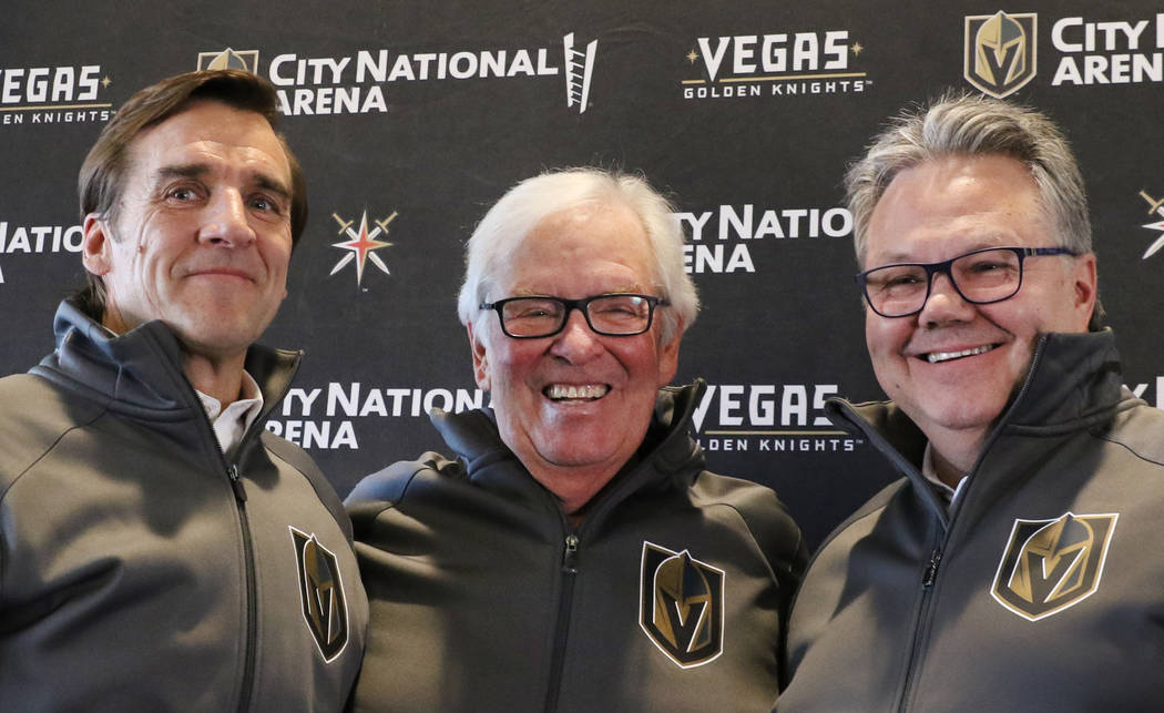 Golden Knights owner Bill Foley, center, President of Hockey Operation George McPhee, left, and ...