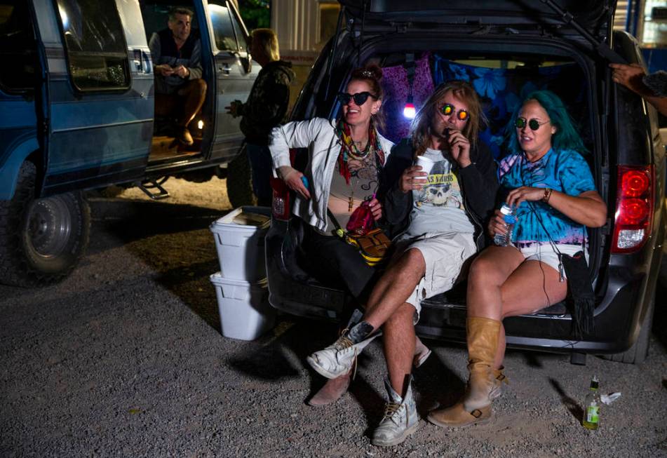 Marge Lemay, left, Martin Bo Jarski and Karen Peterson relax in a van outside the Little A'Le'I ...