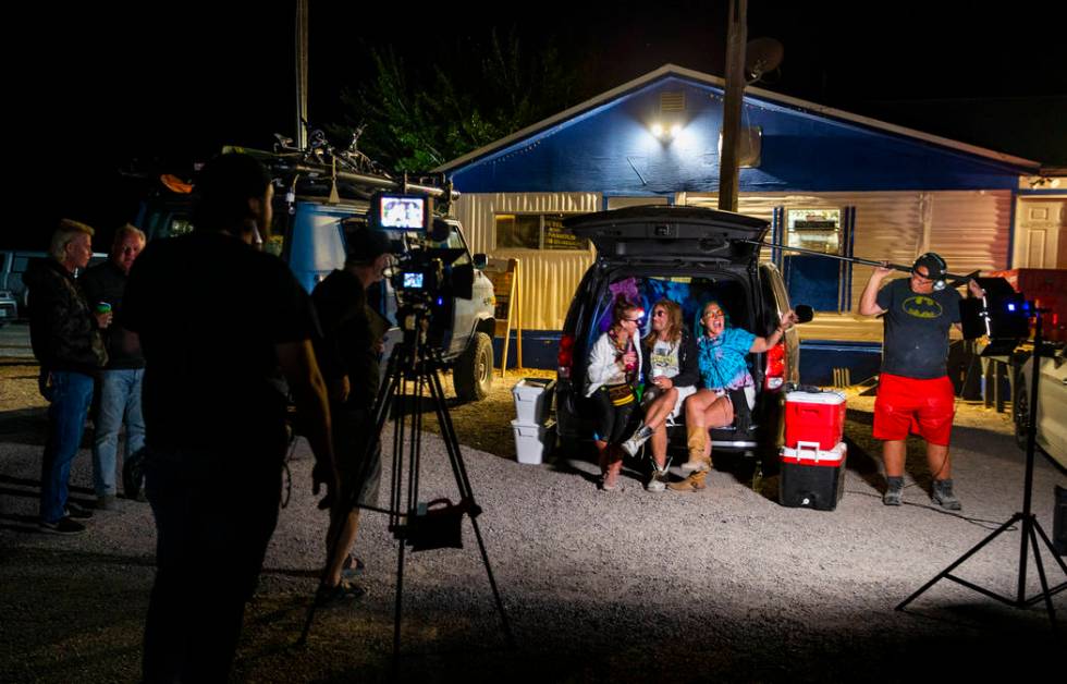 Marge Lemay, left, Martin Bo Jarski and Karen Peterson give an interview while relaxing in a va ...