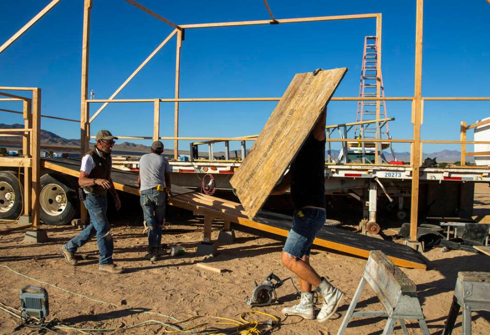 The construction crew begins work on finishing the main stage as the start of the Alienstock fe ...