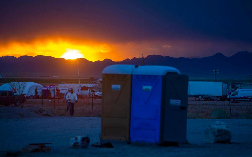 The sun sets on festivalgoers as the start of the Alienstock festival nears on Thursday, Sept. ...