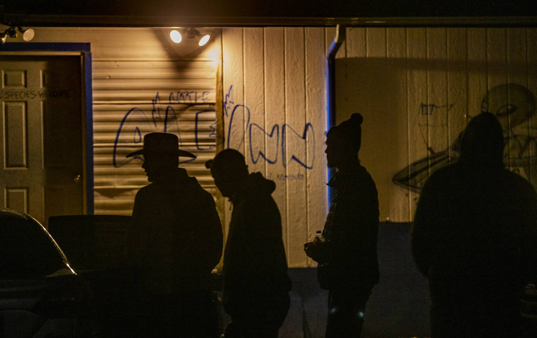 Festivalgoers arrive at the Little A'Le'Inn late on the first night of Alienstock on Thursday, ...