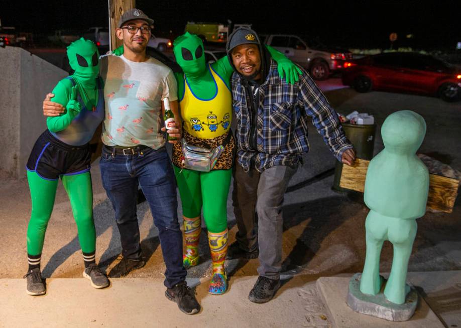 Festivalgoers Michael Solarzano, left, and James Bivens hang out with some aliens at the Little ...