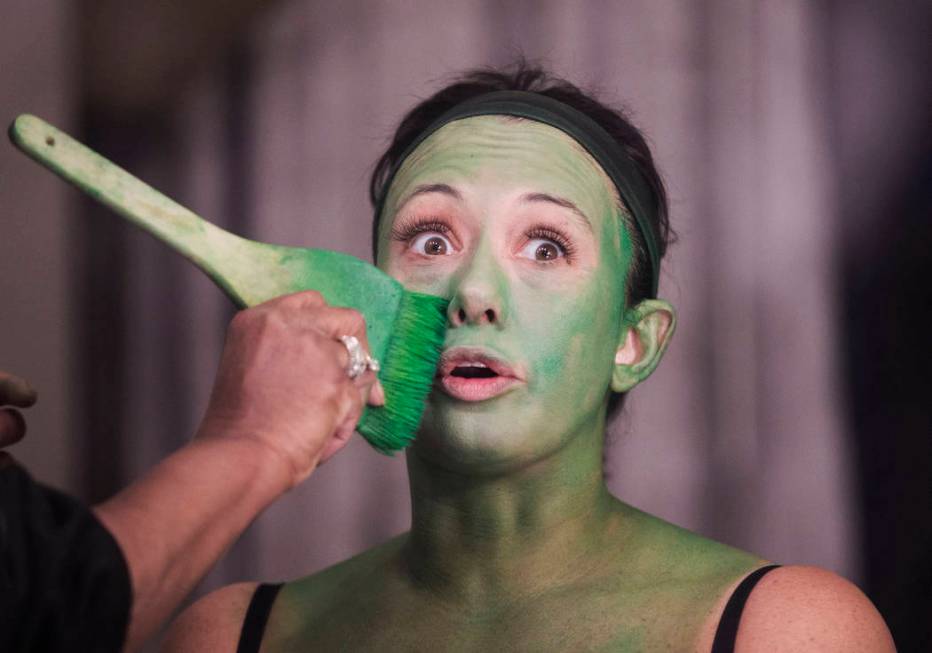 Mariand Torres, who plays Elphaba in "Wicked," gets her makeup done before the show at The Smit ...