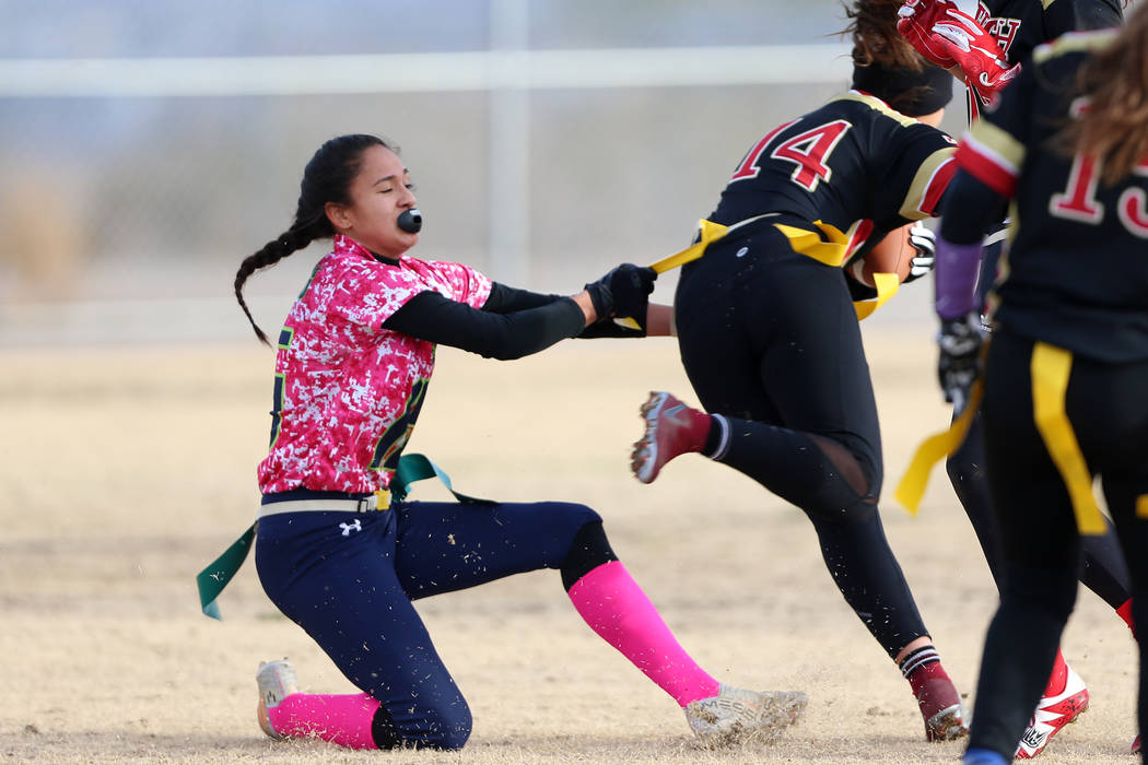 Green Valley junior Jazlyn Camacho (15) makes a tackle against SECTA's Emily Sepulveda (14) in ...