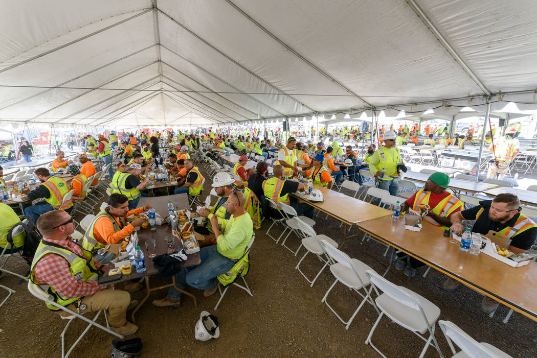 Construction workers enjoy a lunch prepared by Levy, the team's newly announced food service pa ...