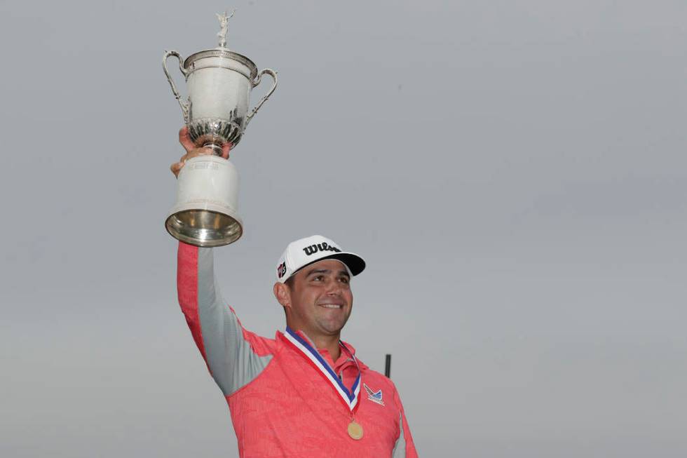 Gary Woodland celebrates with the trophy after winning the U.S. Open Championship golf tourname ...