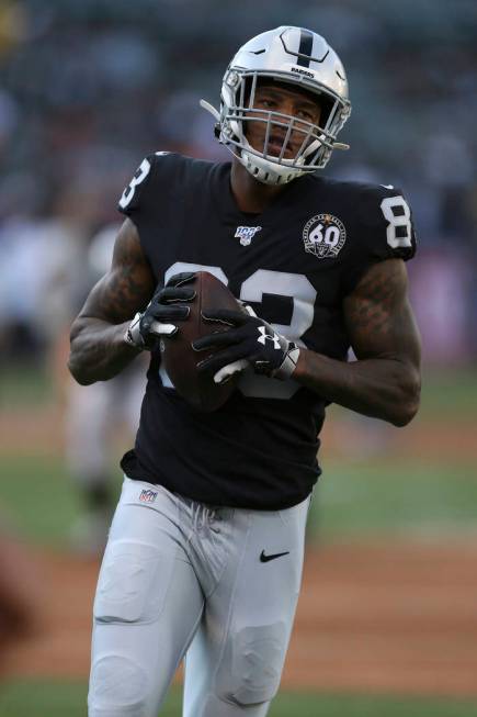 Oakland Raiders tight end Darren Waller runs the ball during an NFL football game against the D ...