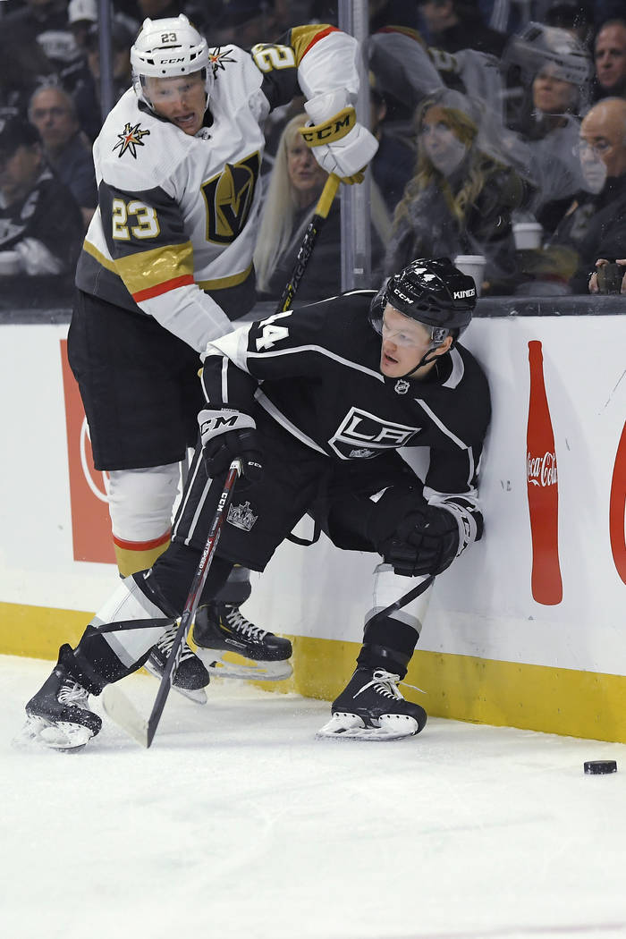 Vegas Golden Knights center Patrick Brown, left, and Los Angeles Kings defenseman Mikey Anderso ...