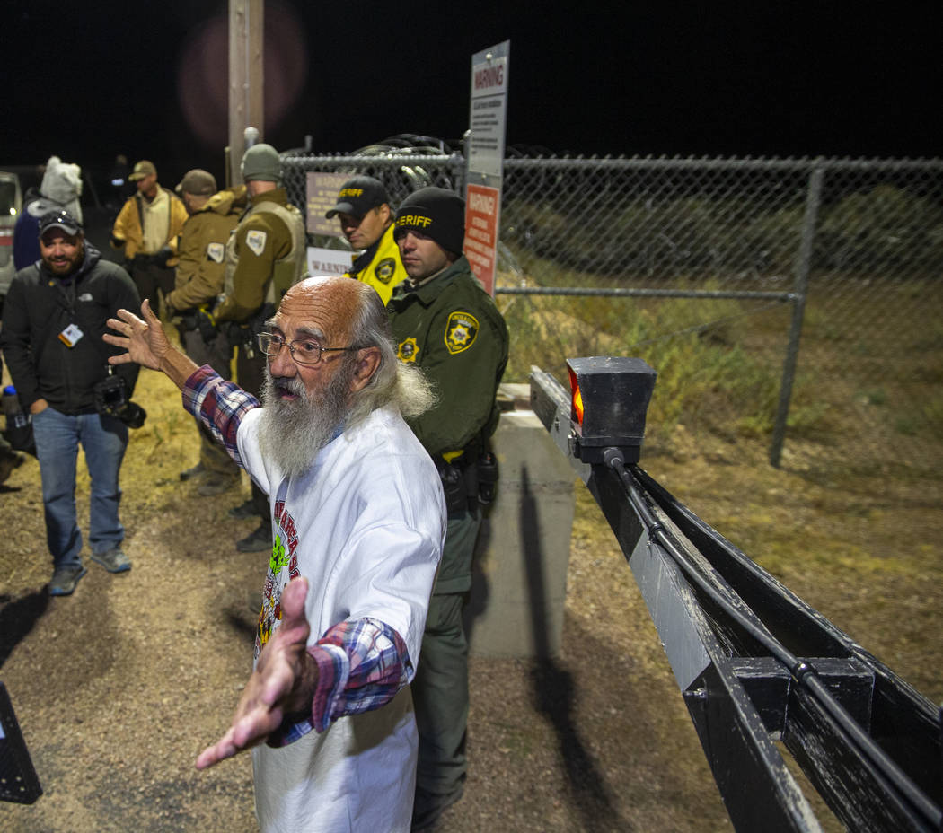 Jody Pendarvis of Bowman, S.C., addresses the crowd standing near security personnel outside th ...