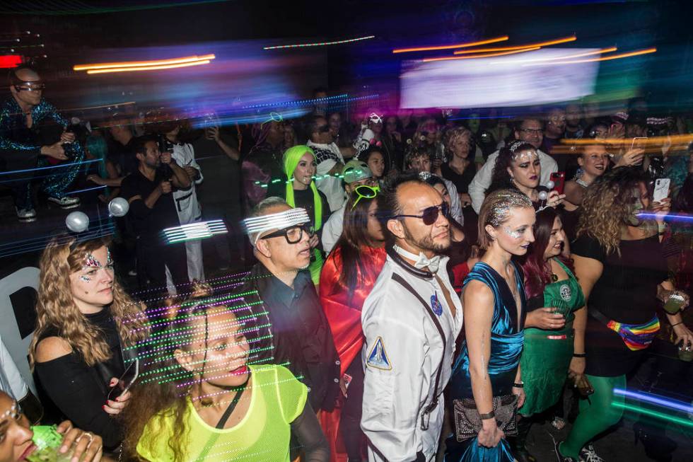 Attendees watch the Big Nazo Intergalactic Creature Band perform during a pre party for Storm A ...