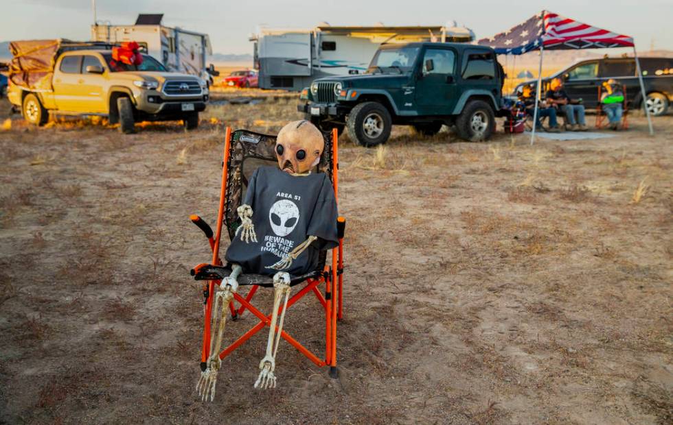 An alien relaxes in the off-site parking across from the Alienstock festival on Friday, Sept. 2 ...