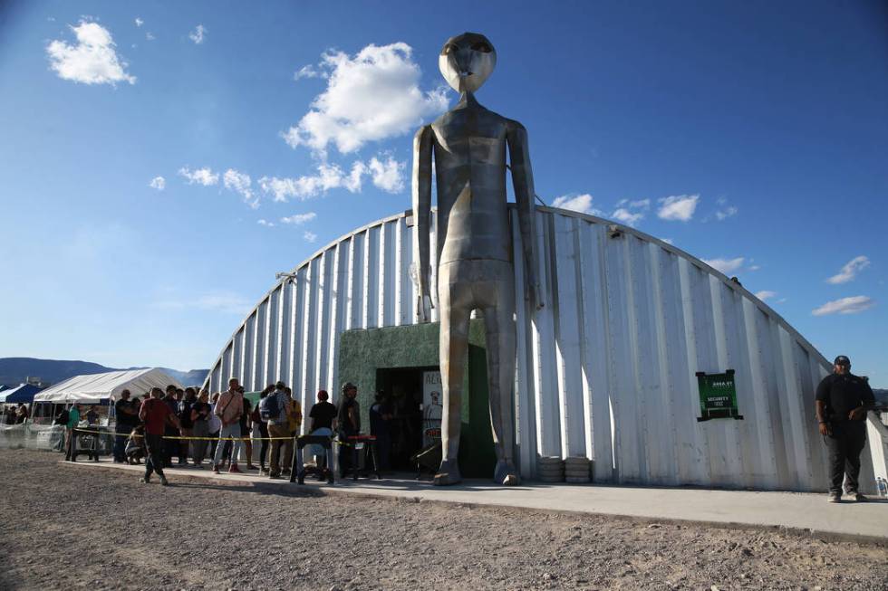 People wait in line to enter the Alien Research Center store in Hiko, Nev., Friday, Sept. 20, 2 ...