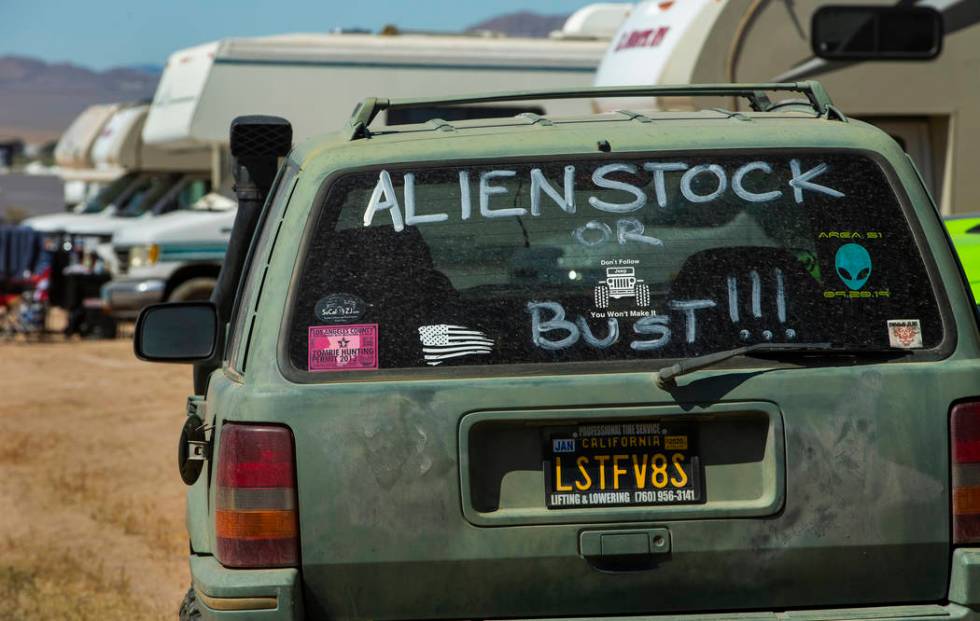 Sign on the rear window of a car during the Alienstock festival on Friday, Sept. 20, 2019 in Ra ...