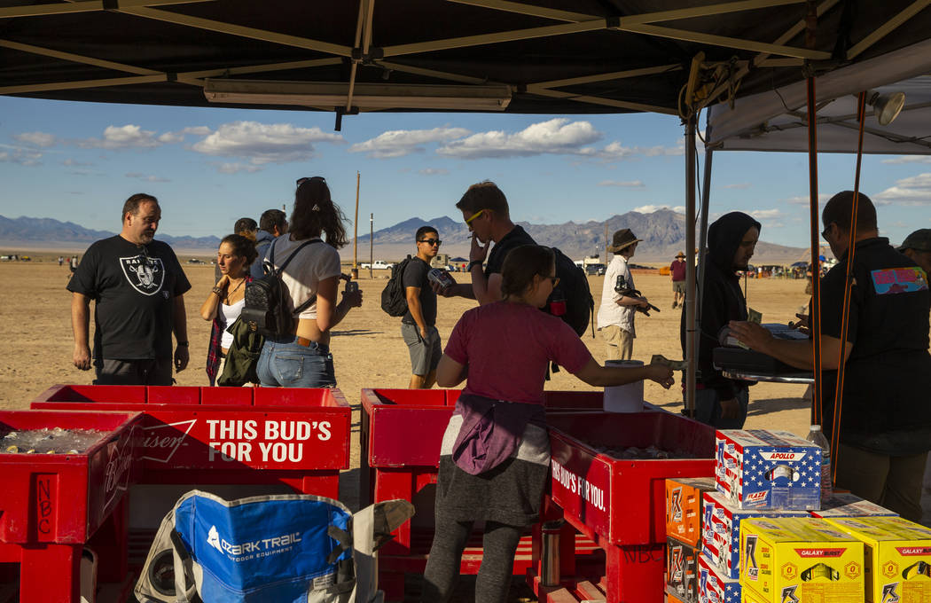 The Little A'Le'Inn sells drinks and merchandise from their booths during the Alienstock festiv ...