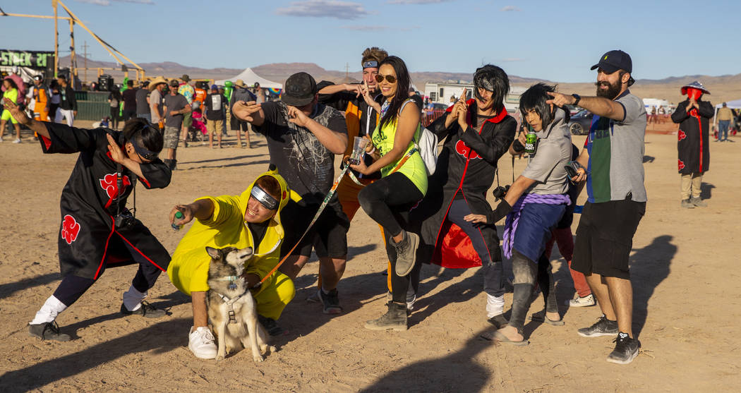 Festivalgoers strike a pose on the festival grounds during the Alienstock on Friday, Sept. 20, ...