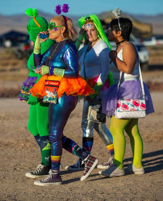 Festivalgoers are costumed up and wander about the grounds during the Alienstock festival on Fr ...